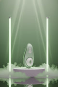 Stimulateur clitoridien voyage Womanizer Liberty 2 vert Pleasure Air sans contact 8 niveaux intensité couvercle rangement magnétique silicone hypoallergénique sans phtalates étanche IPX7 rechargeable USB magnétique 10,5x5x4cm